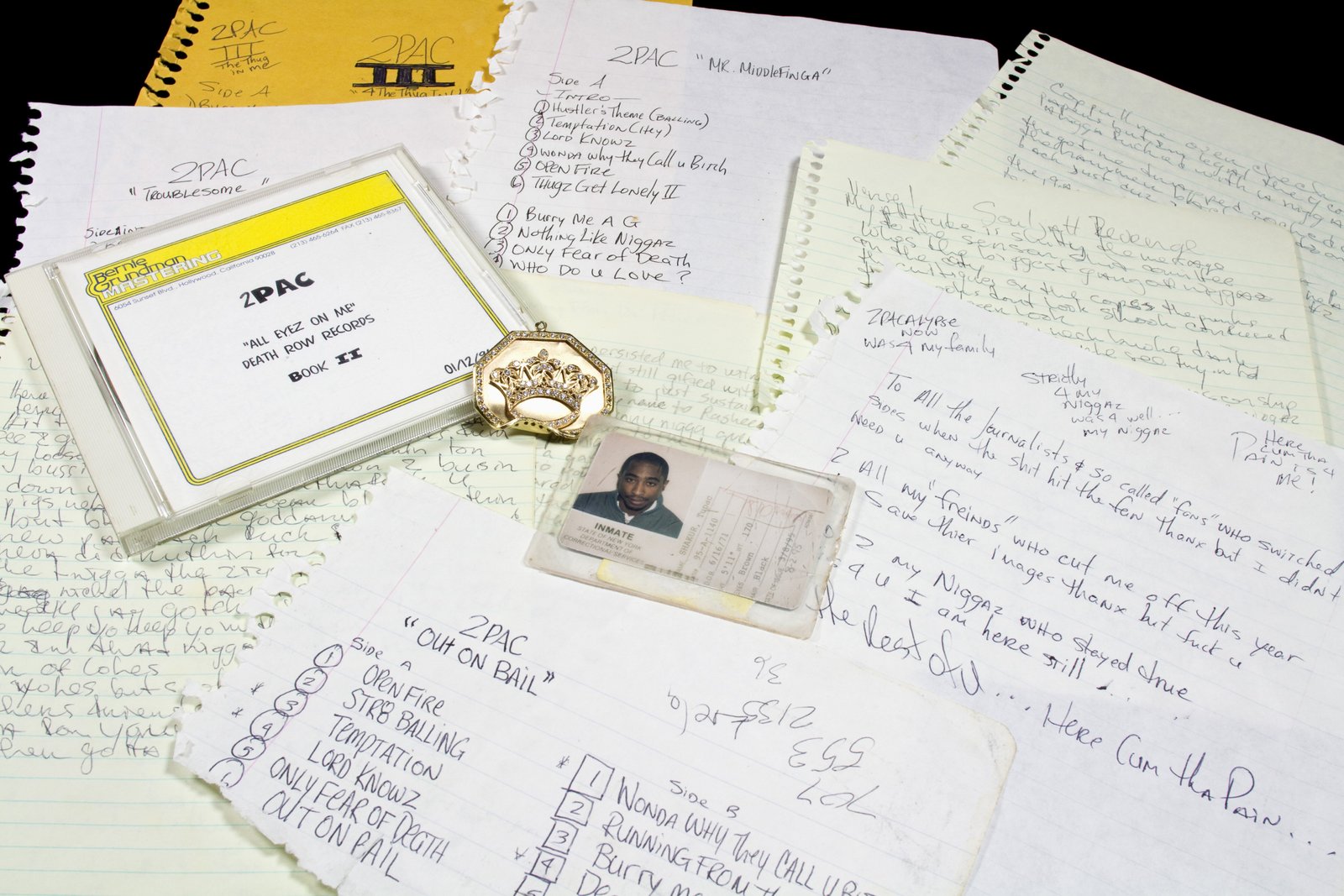A variety of Tupac Shakur items, including his prison ID card